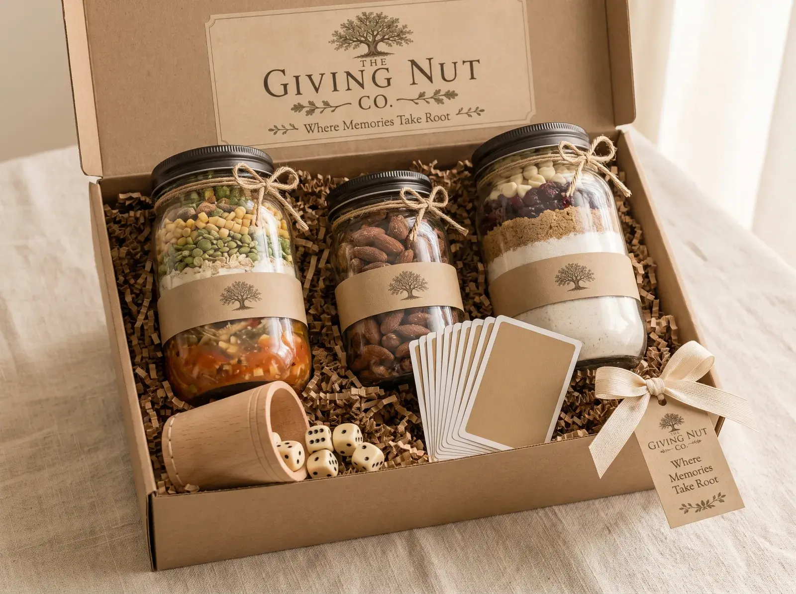 Stay Awhile, open: three labelled jars with dice, playing cards and a scorepad in a kraft gift box